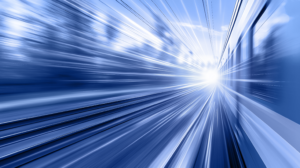 blue motion-blurred image of a high-speed passenger train